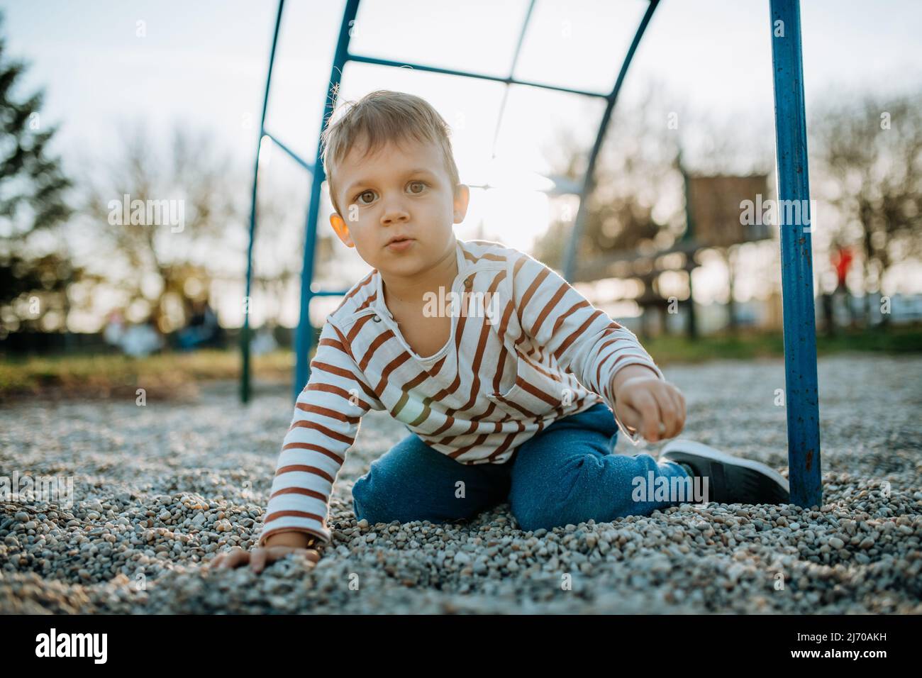 A little boy playing on outdoor playground Stock Photo - Alamy