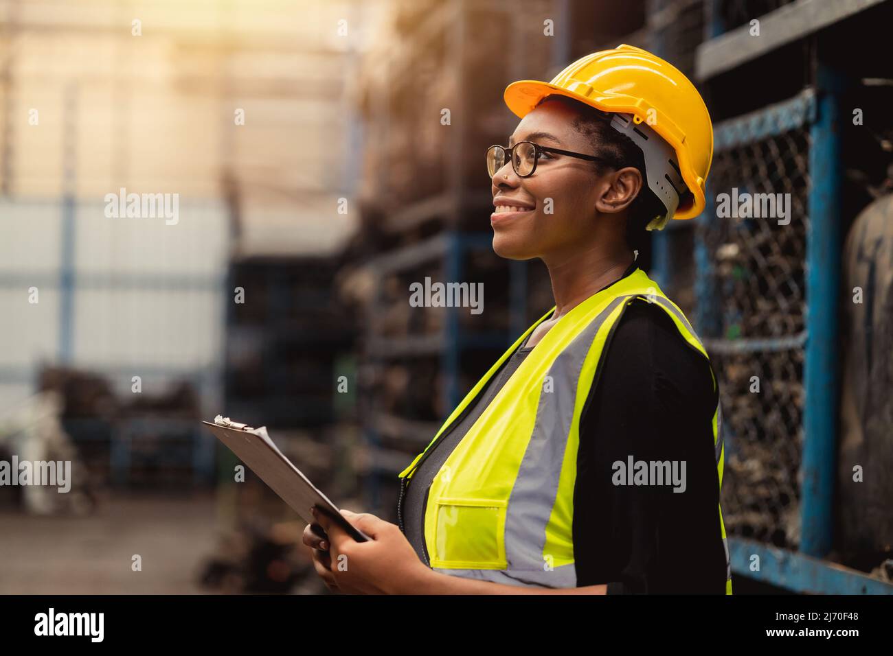 Happy Black African women engineer worker enjoy working in factory industry. Stock Photo