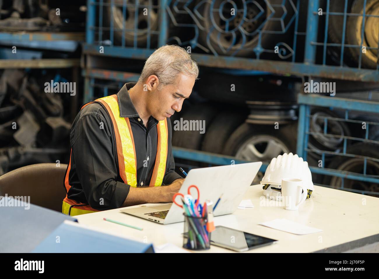 professional engineer foreman working intense at desk seriously look