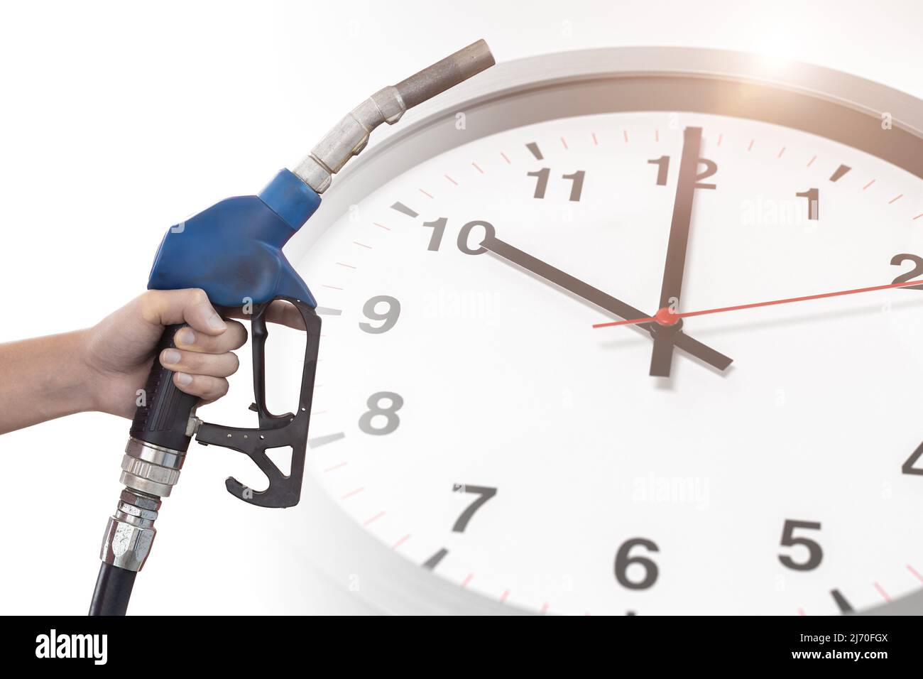 Fuel nozzle overlay with time clock for Fossil Oil Gasoline run out countdown timing concept. Stock Photo