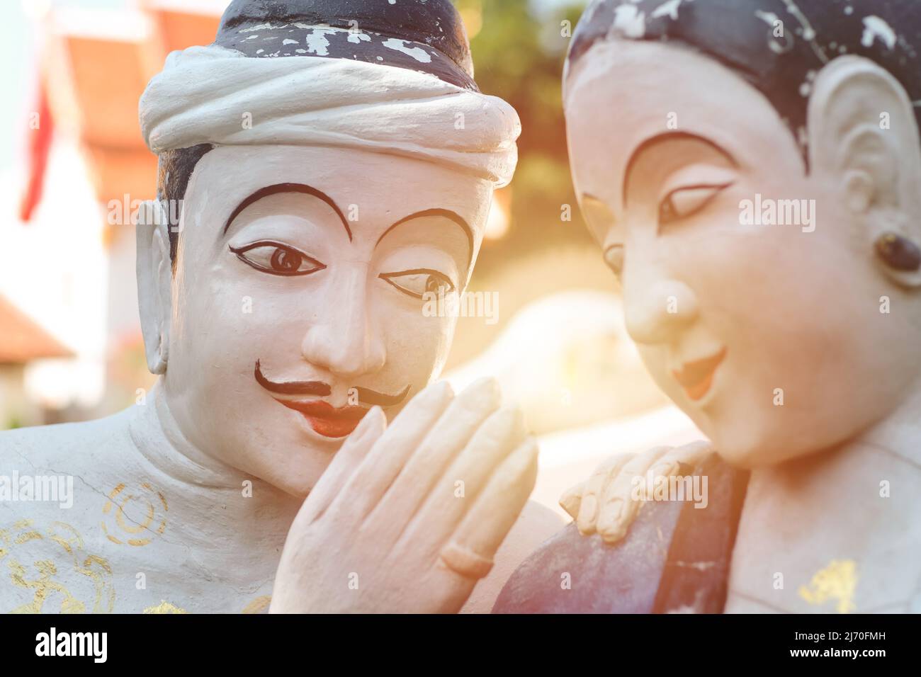 Love whispering man to women couple lover statue legend story landmark of Nan province, July 2020. THAILAND Stock Photo