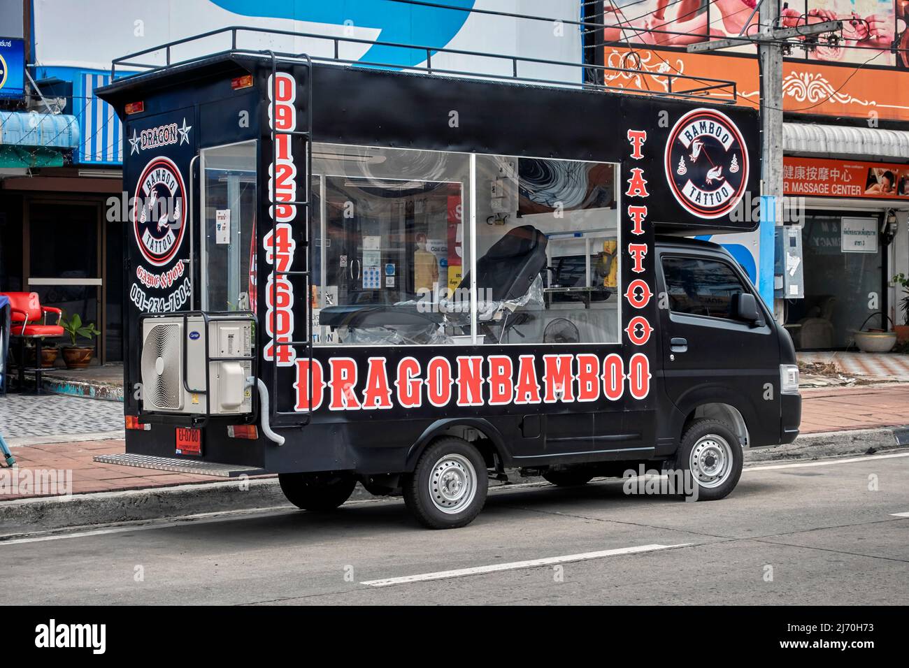 Tattoo parlor housed in a converted camper van complete with tattooing chair and air conditioning Thailand Southeast Asia Stock Photo