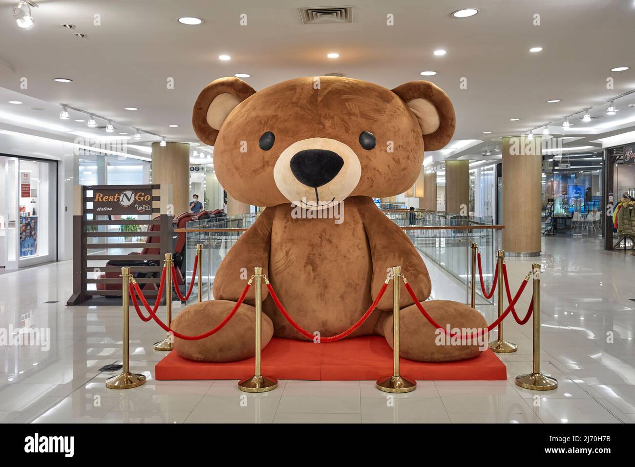 Large Teddy Bear feature in a shopping mall interior, Thailand Southeast Asia Stock Photo