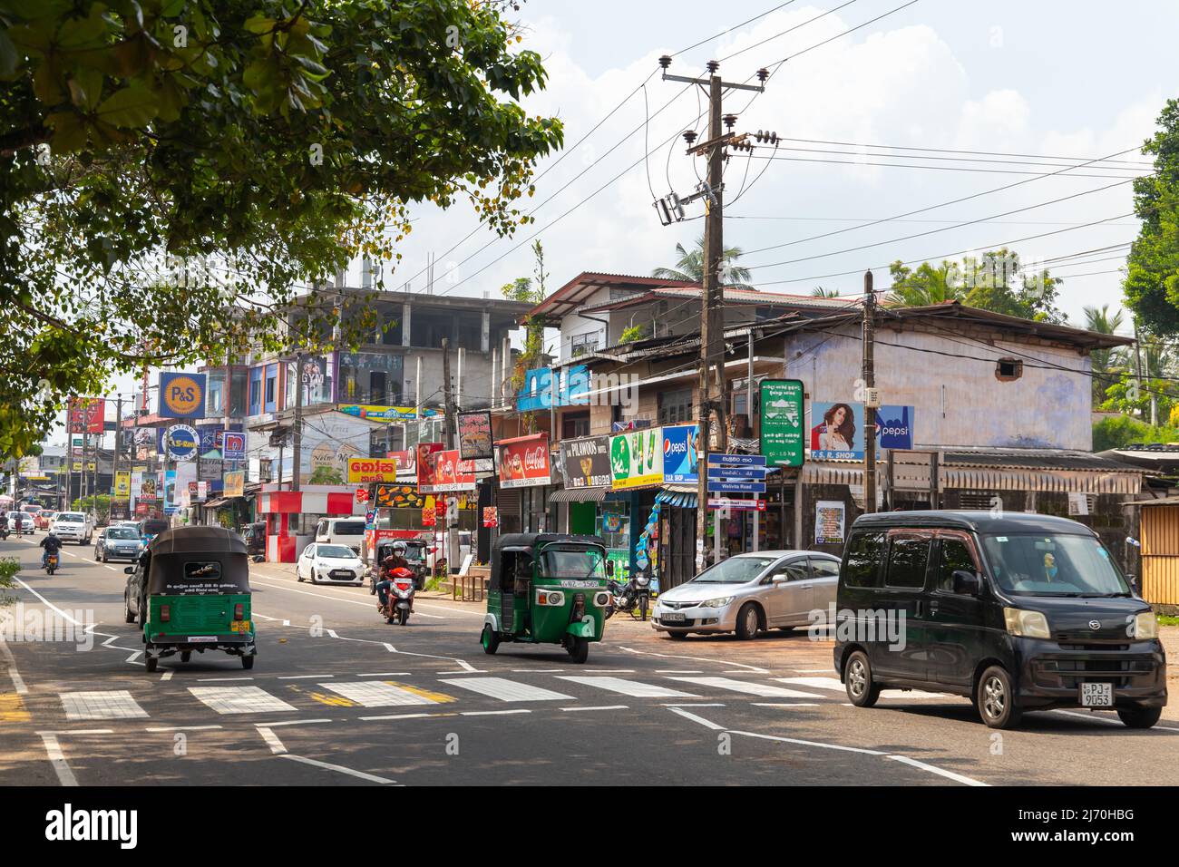 Malabe, Sri Lanka - December 4, 2021: Cars, scooters and tuk tuks are ...