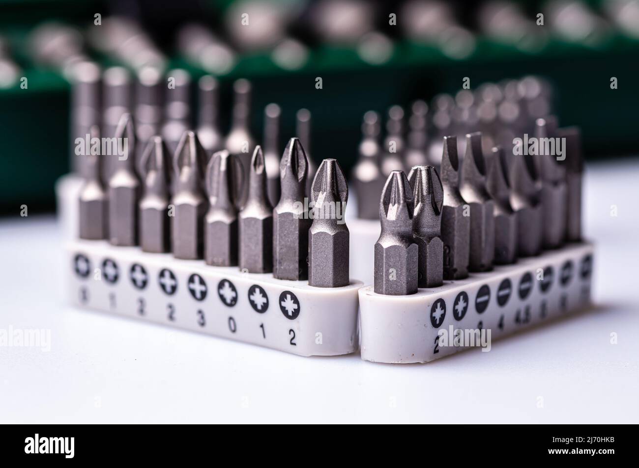 Interchangeable screwdriver bit set, isolated on white, selective focus