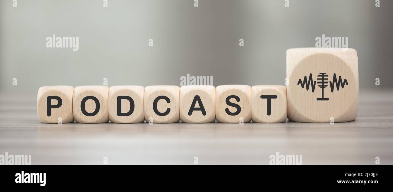 Wooden blocks with symbol of podcast concept Stock Photo Alamy