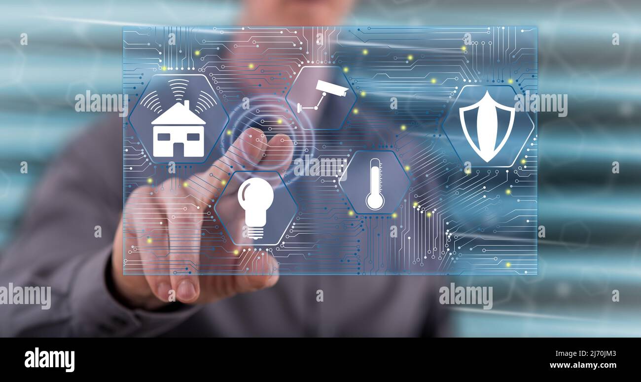 Man touching a smart home concept on a touch screen with his finger ...