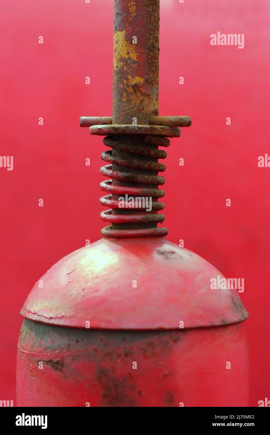 Traditional vintage bright red tractor mechanical engine and frame ...