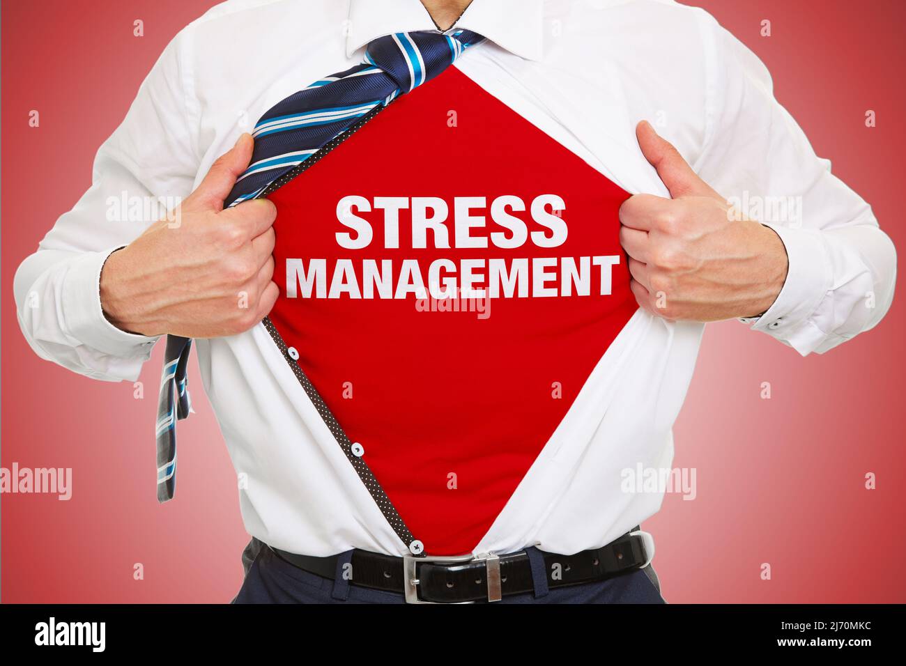 Businessman showing lettering Stress Management under open shirt as concept Stock Photo