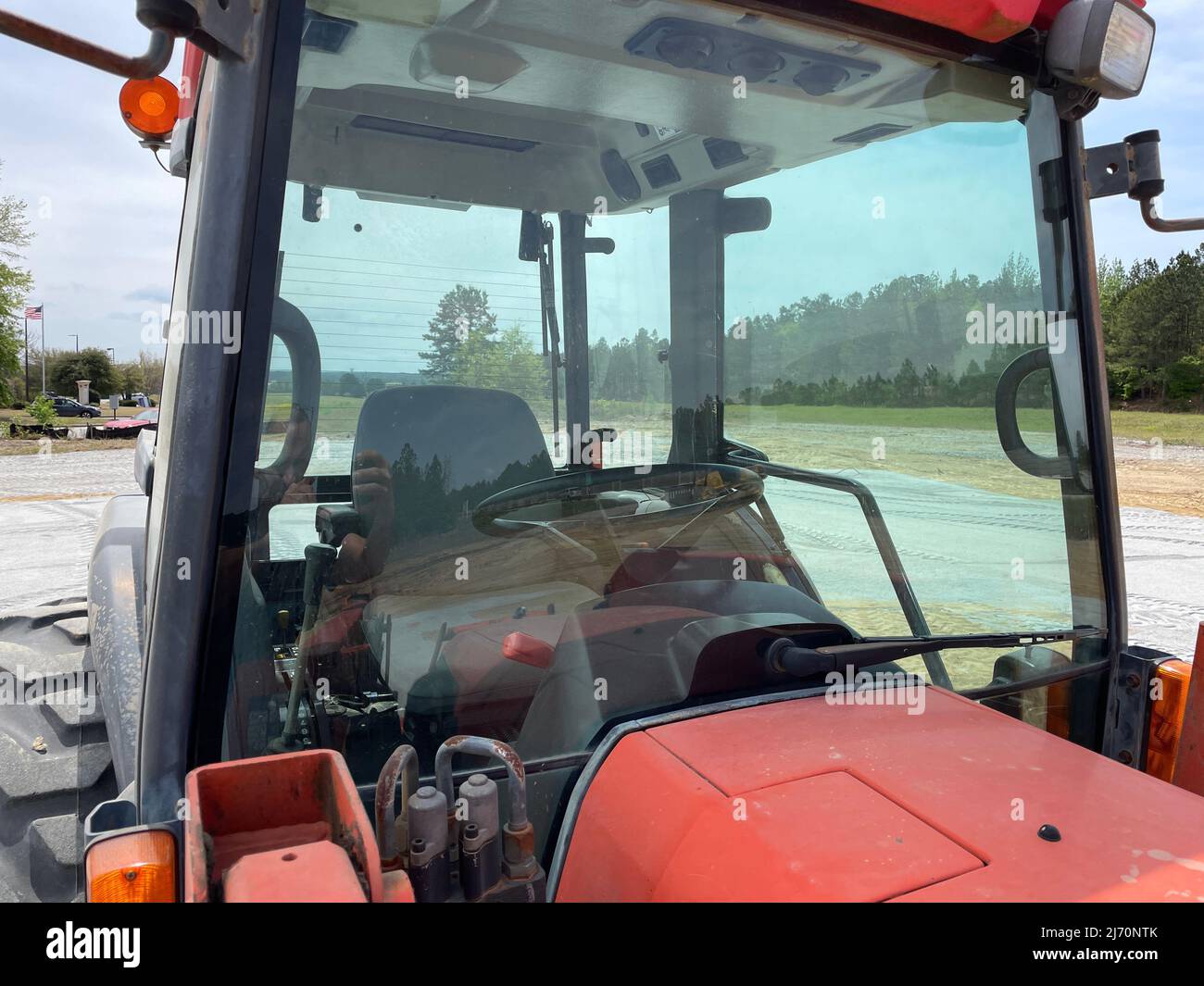 Augusta, Ga USA 04 13 22 Kubota red tractor front view of cab Stock