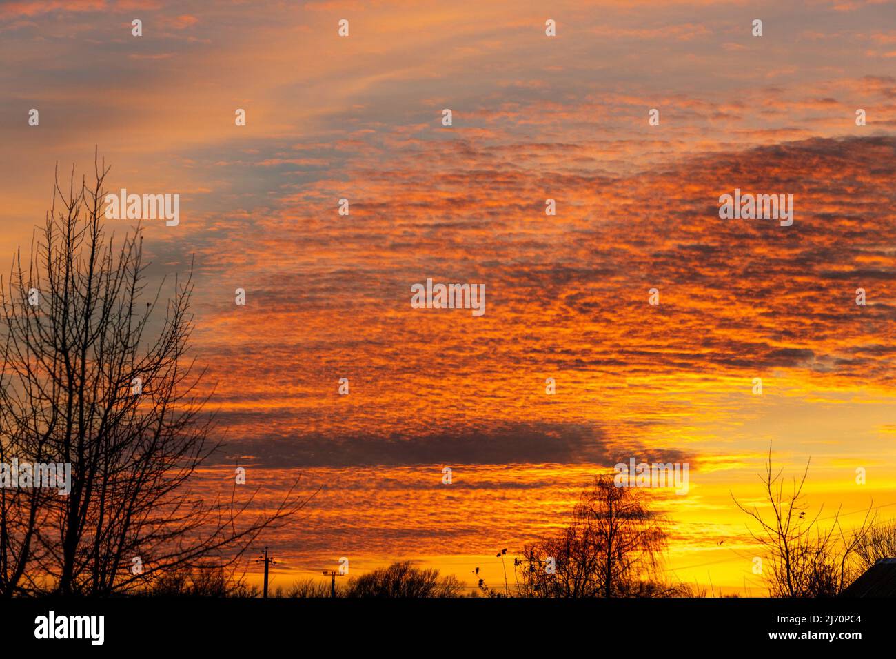 Beautiful sky landscape with yellow clouds at a sunset Stock Photo - Alamy