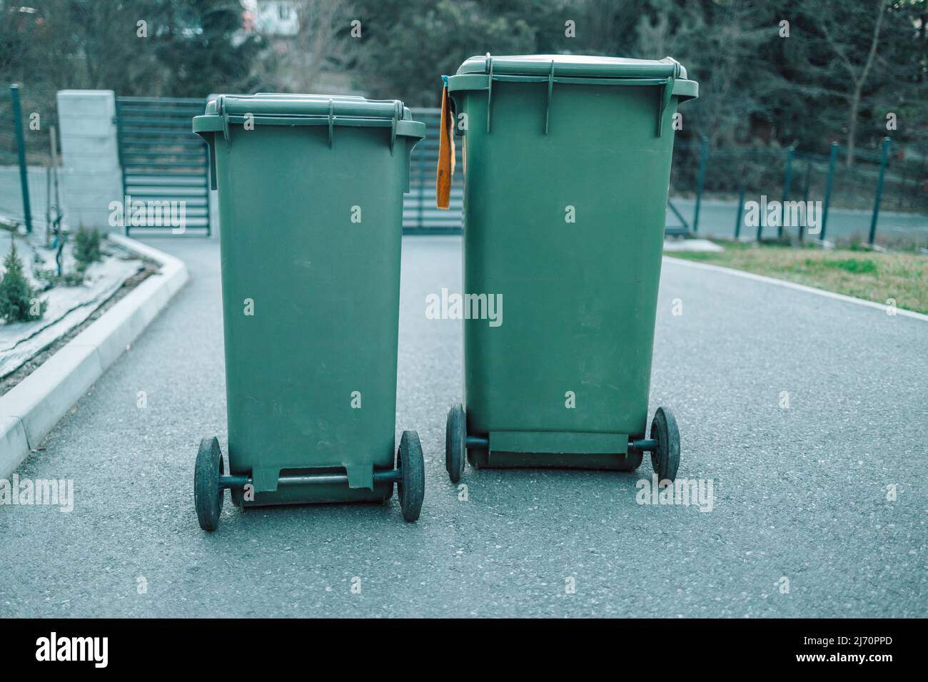 Rubbish bins next to a properties awaiting to be collected Stock Photo