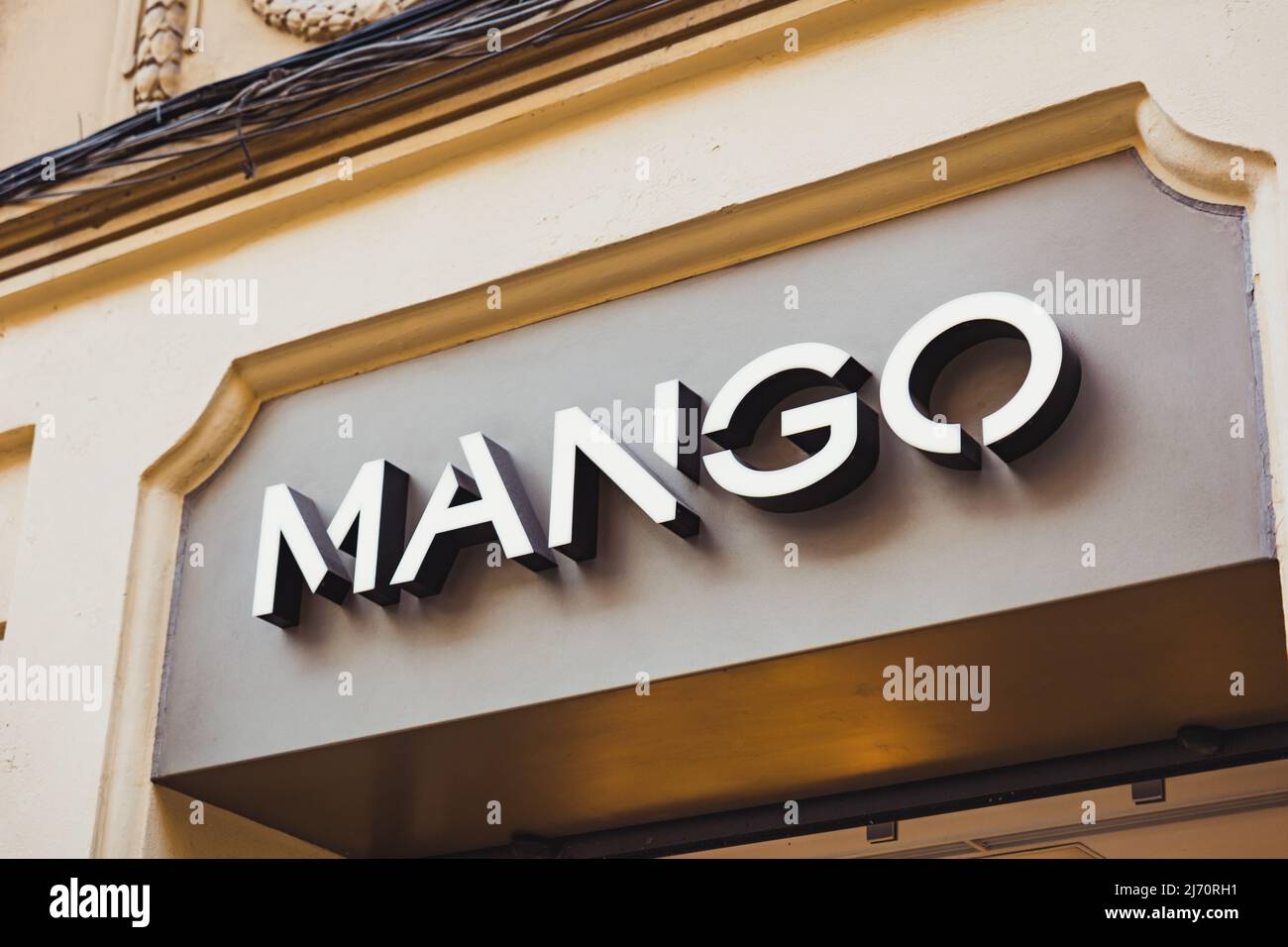 Valencia, Spain - April 2022: Facade with the Mango shop logo in Valencia.  Mango clothing store in Valencia. Mango is one of the most famous spanish f  Stock Photo - Alamy