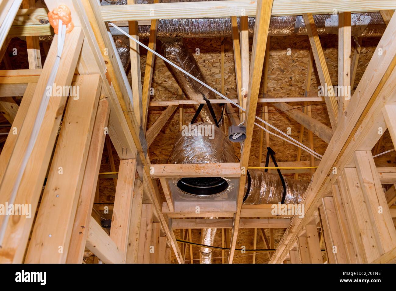 A new building under construction with installation of HVAC tubing
