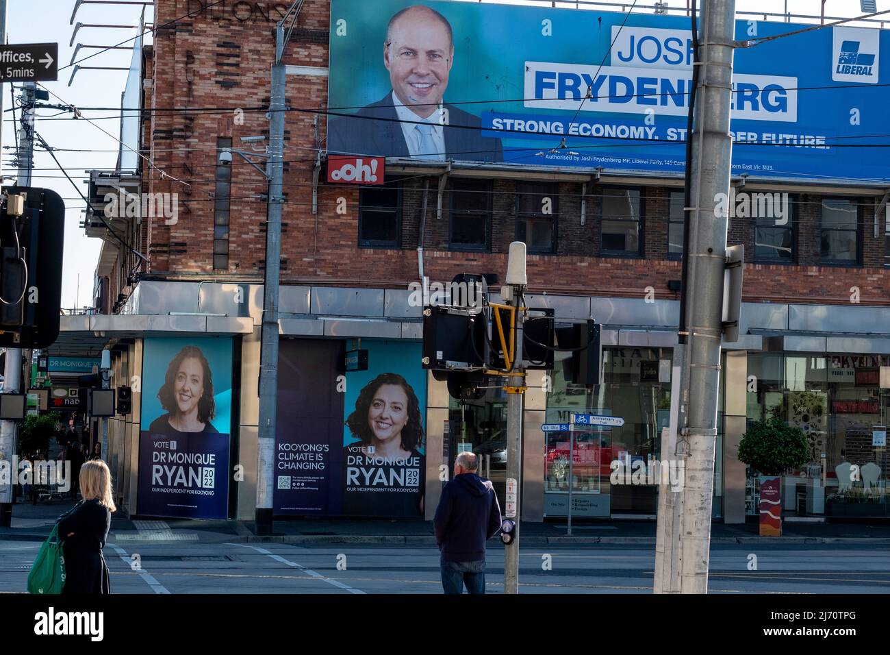 Political posters advertising Josh Frydenberg the Treasurer and his opponent Dr Monique Ryan an independent, who are contesting the seat of Kooyong in the 2022 Australian Federal elections. Stock Photo