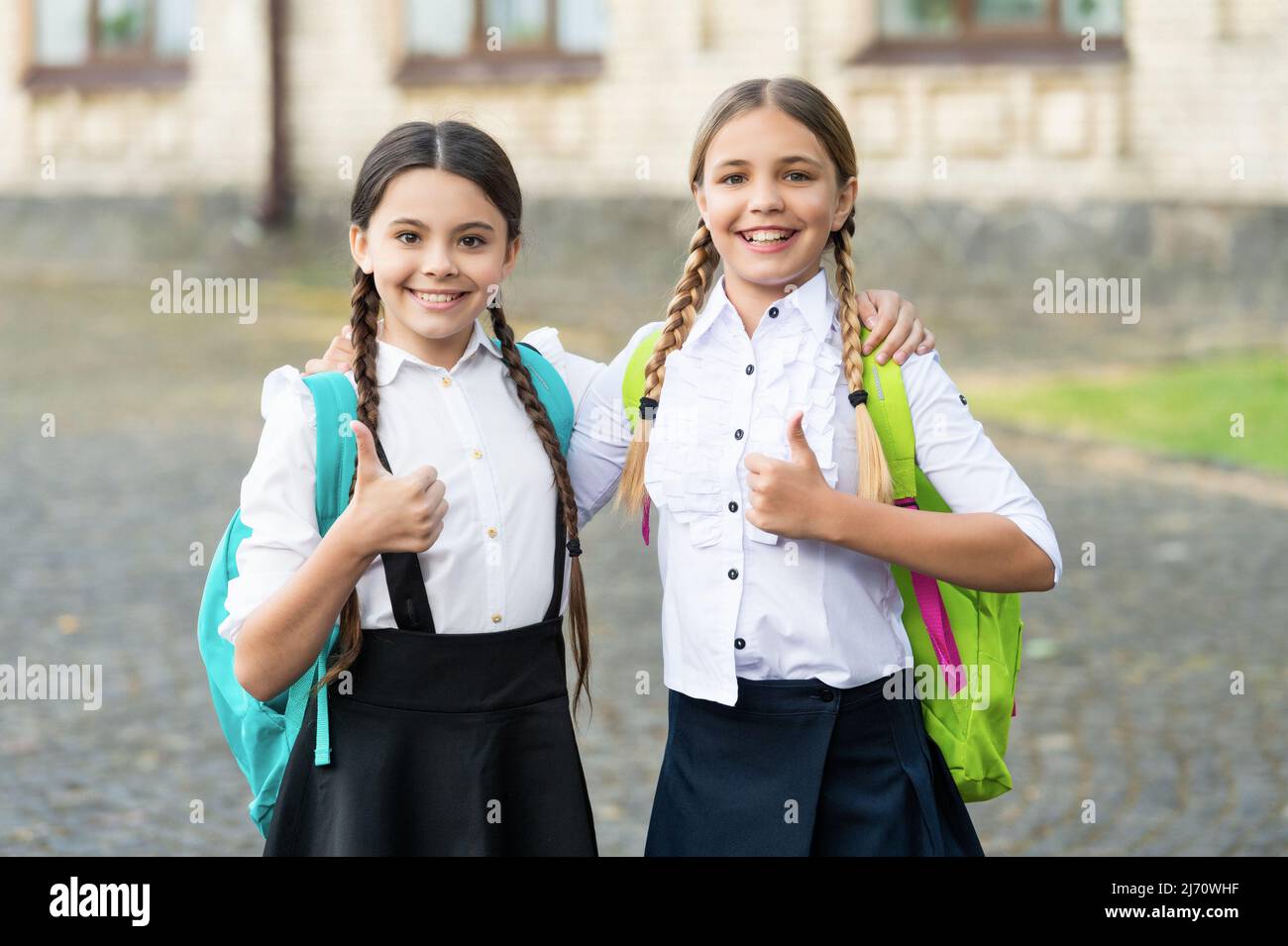 Kids hug school uniform hi-res stock photography and images - Alamy