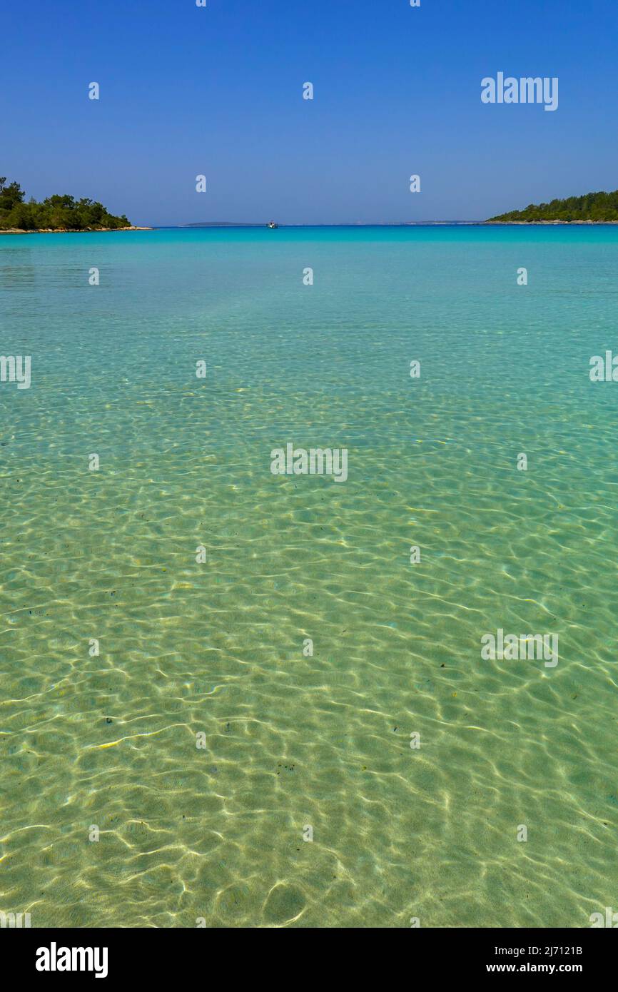 Blue water at Çamkoru Sitesi Plajı beach near Akbuk, Turkey Stock Photo