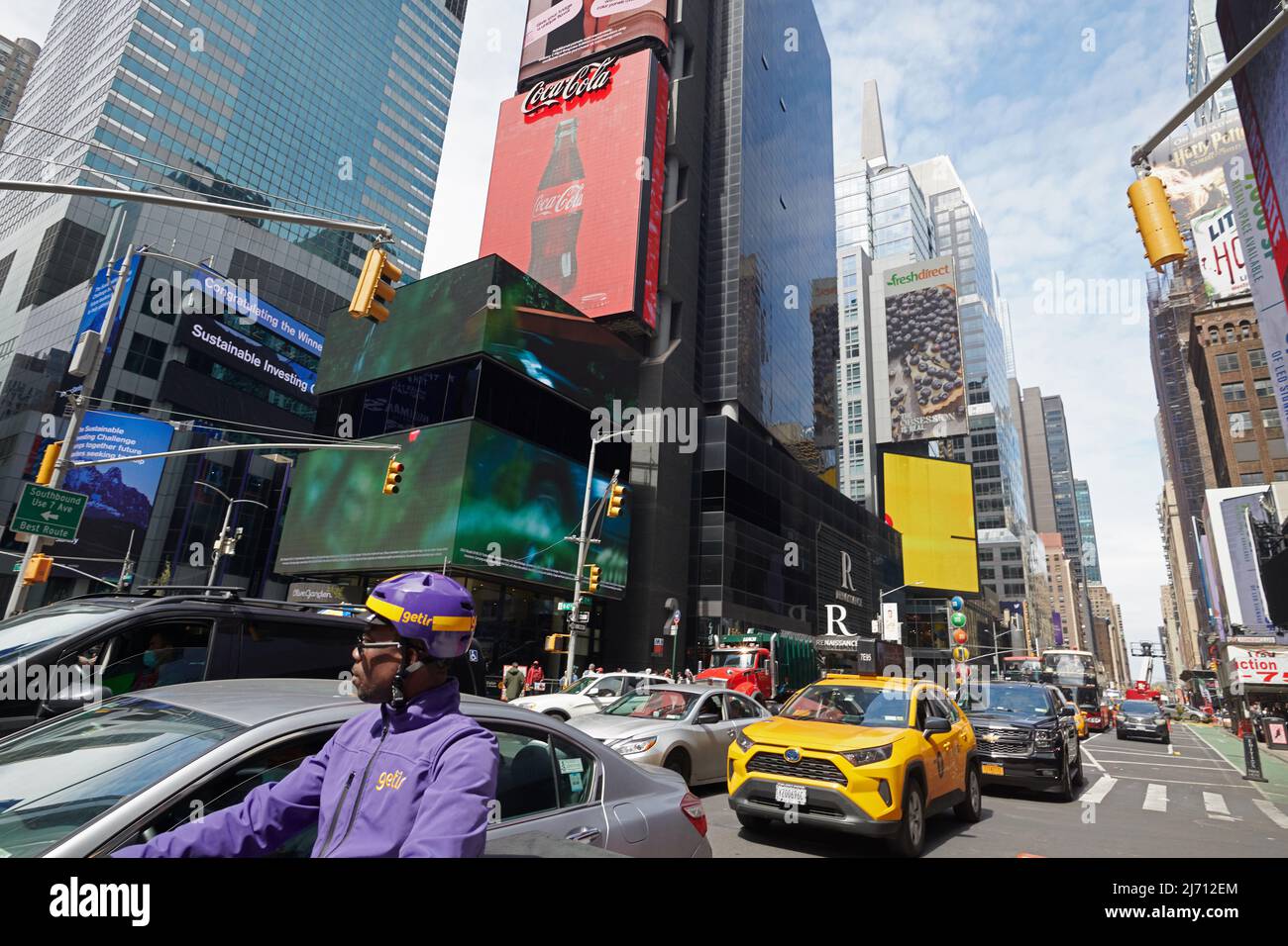 Time Square in Manhattan New York City in the day is always busy and attracts thousands of tourists Stock Photo
