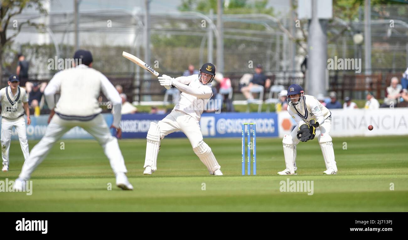 Hove UK 5th May 2022 -  Tom Alsop of Sussex hits the ball for 4 runs against Middlesex on the first day of their LV= Insurance County Championship match at The 1st Central County Ground  in Hove . : Credit Simon Dack / Alamy Live News Stock Photo