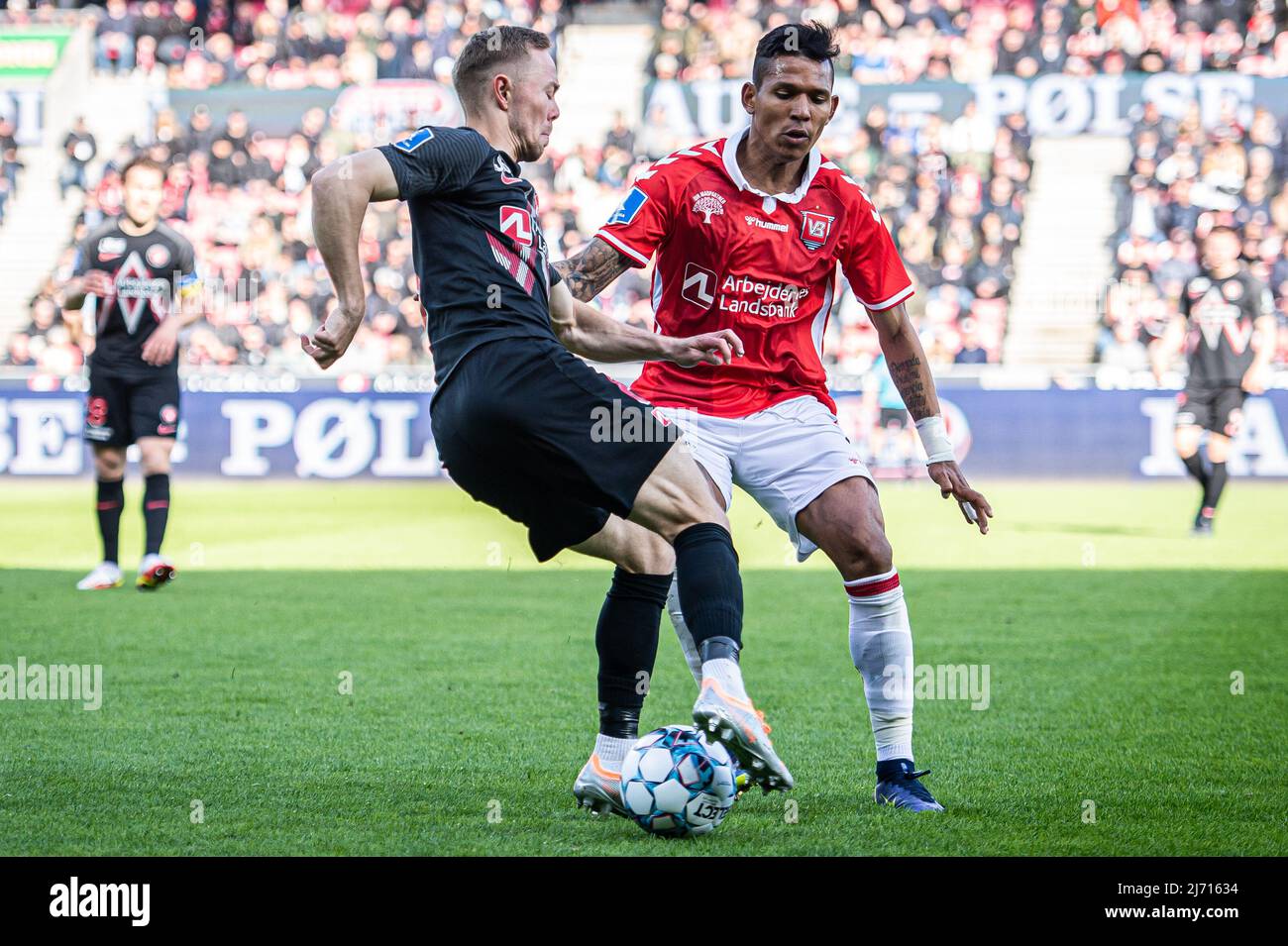 Herning, Denmark. 04th, May 2022. Joel Andersson (6) of FC Midtjylland and Andres Ponce (9) of Vejle Bodlklub seen during the Sydbank Cup match between FC Midtjylland and Vejle Boldklub at MCH Arena in Herning. (Photo credit: Gonzales Photo - Morten Kjaer). Stock Photo