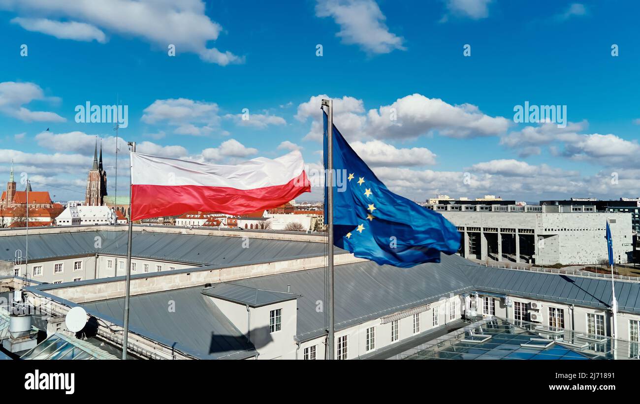 Flags of Poland and European Union waving in the wind Stock Photo - Alamy