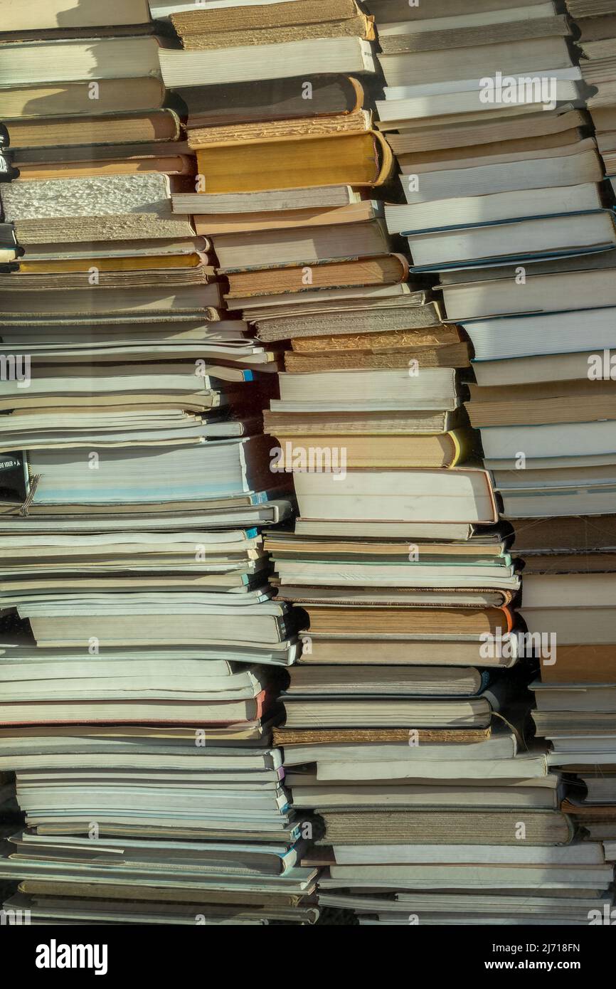Piles of old used books background, back to school, college, university concept Stock Photo