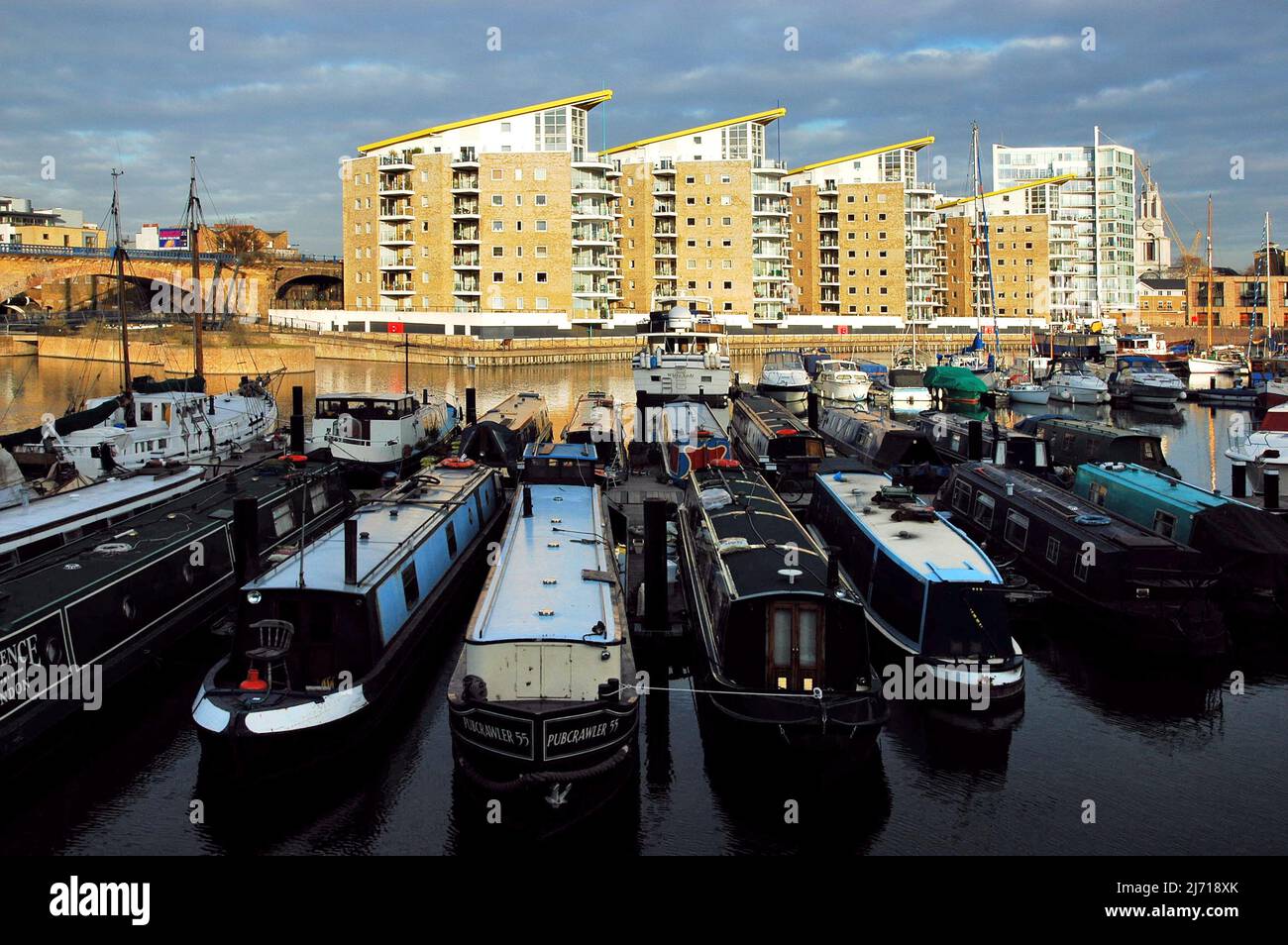 Boats and residential properties, Limehouse Basin in London UK. Stock Photo