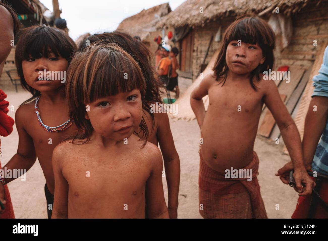 Group of indian children from an Amazon indigenous tribe in Brazil looking curiously at the camera. Baixo Amazonas, Pará, Brazil. 2010. Stock Photo