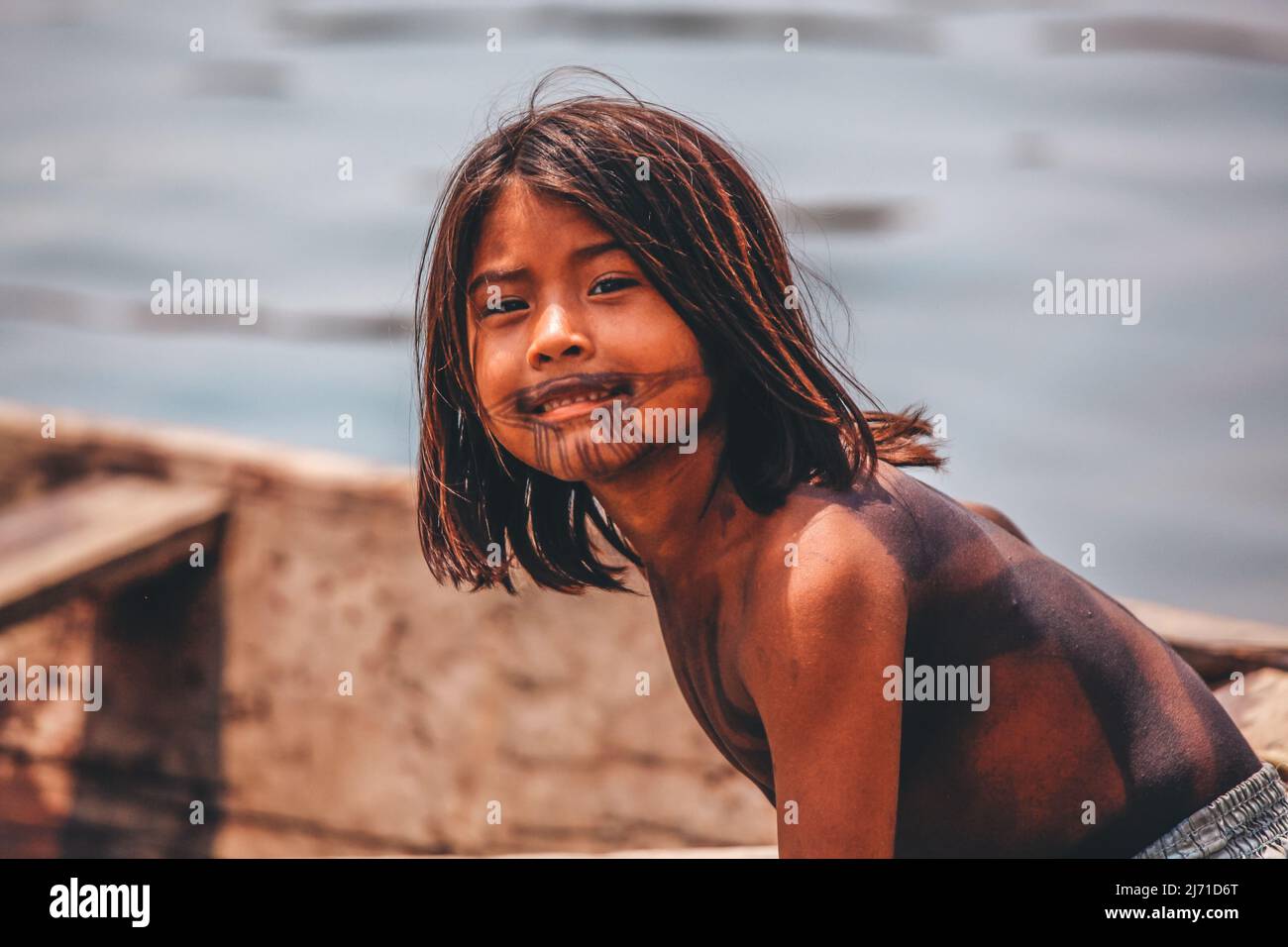 Indian boy smiling to the camera by the Amazon River in Brazil, Baixo Amazonas, 2010. Stock Photo
