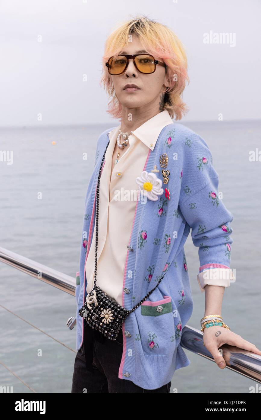 G-Dragon poses before the runway of Chanel Cruise Collection 2022