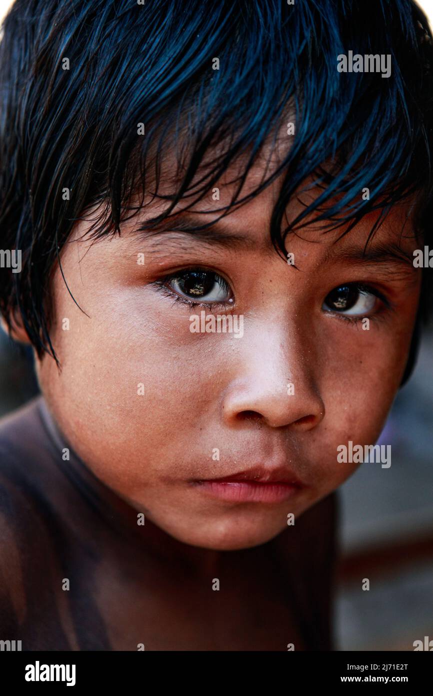 Powerful portrait of indigenous Amazon boy with expressive eyes. Xingu River, Brazilian Amazon, 2010. Stock Photo