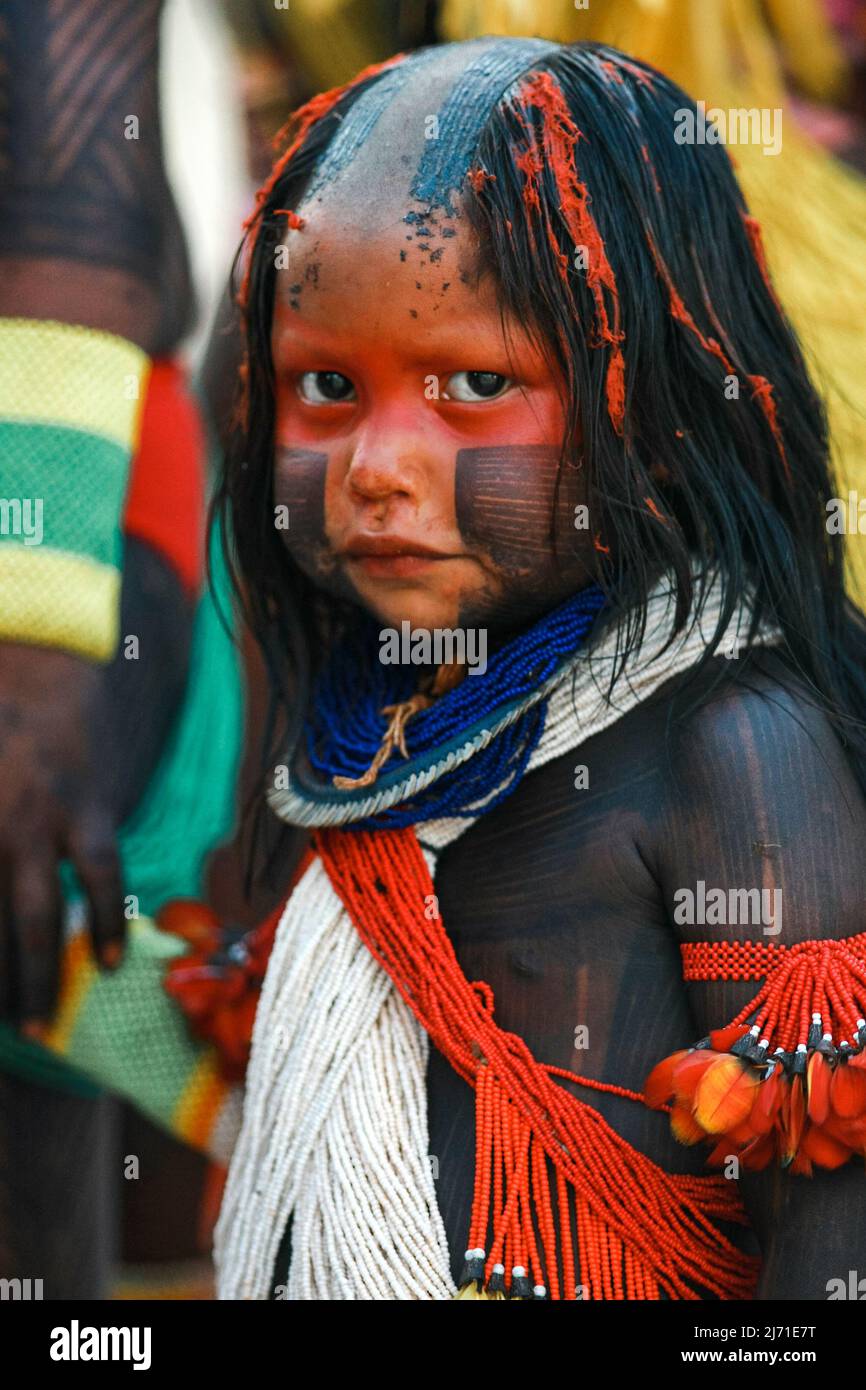Indigenous girl from an Amazon tribe in Brazil with tribal art painted on her body, taking part in the Indigenous Games. Jogos Indígenas, 2009. Stock Photo