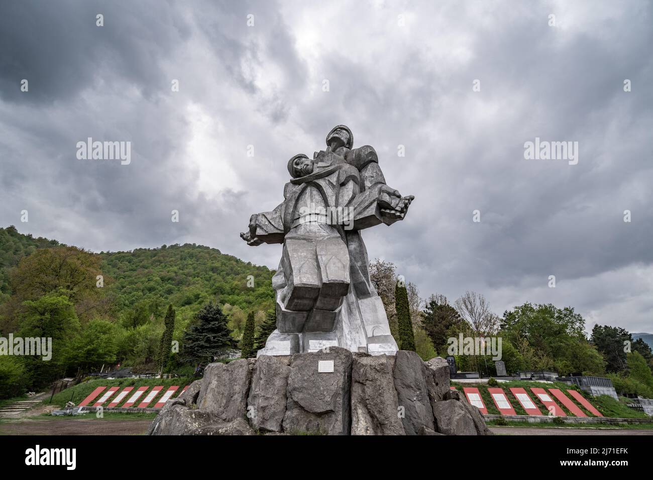 Dilijan, Armenia - May 4, 2022 - Dramatic clouds formation moving behind the Monument to the Great Patriotic War in Dilijan, Armenia Stock Photo