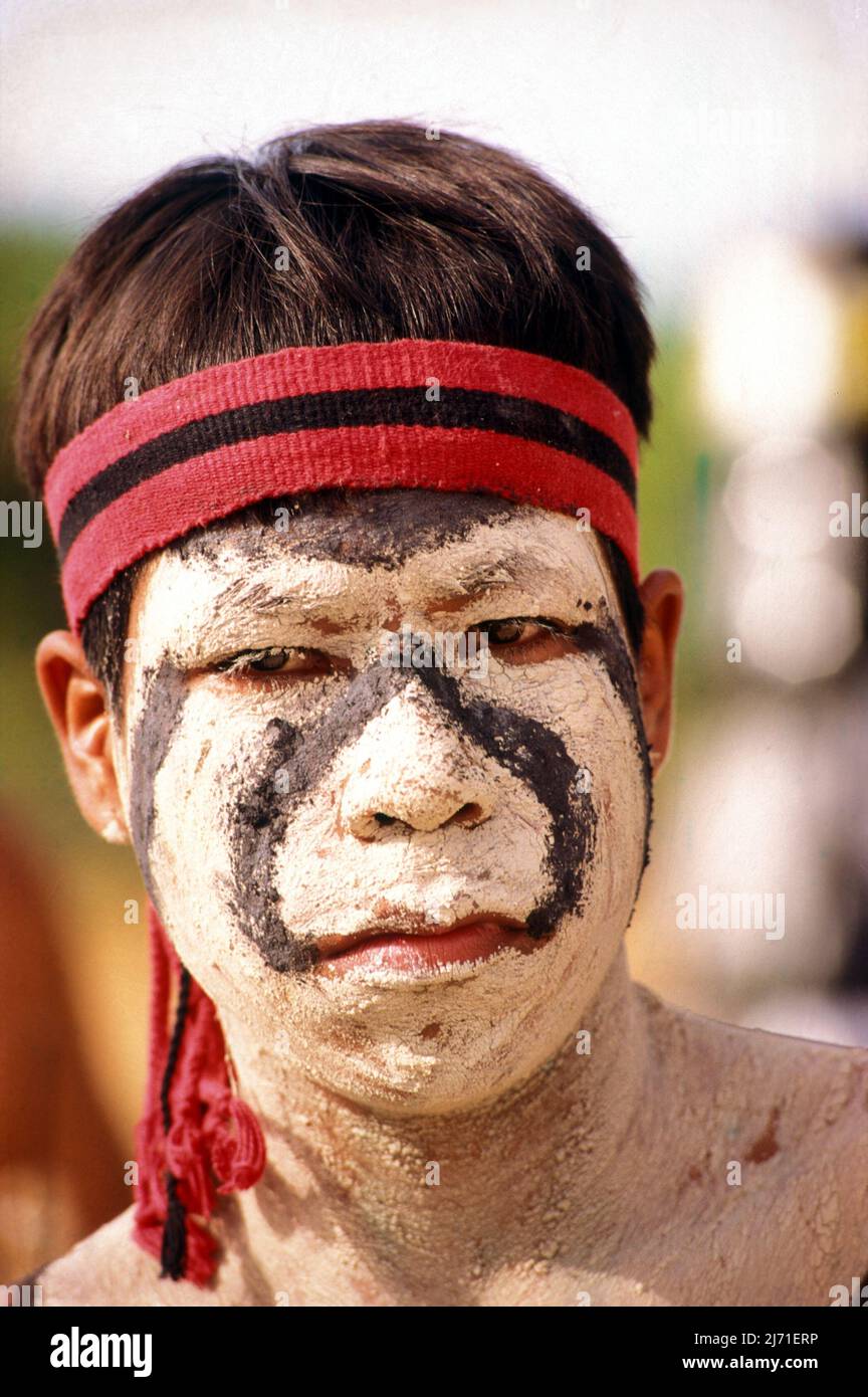 Young indian warrior from a Brazilian Amazon tribe, wearing tribal face