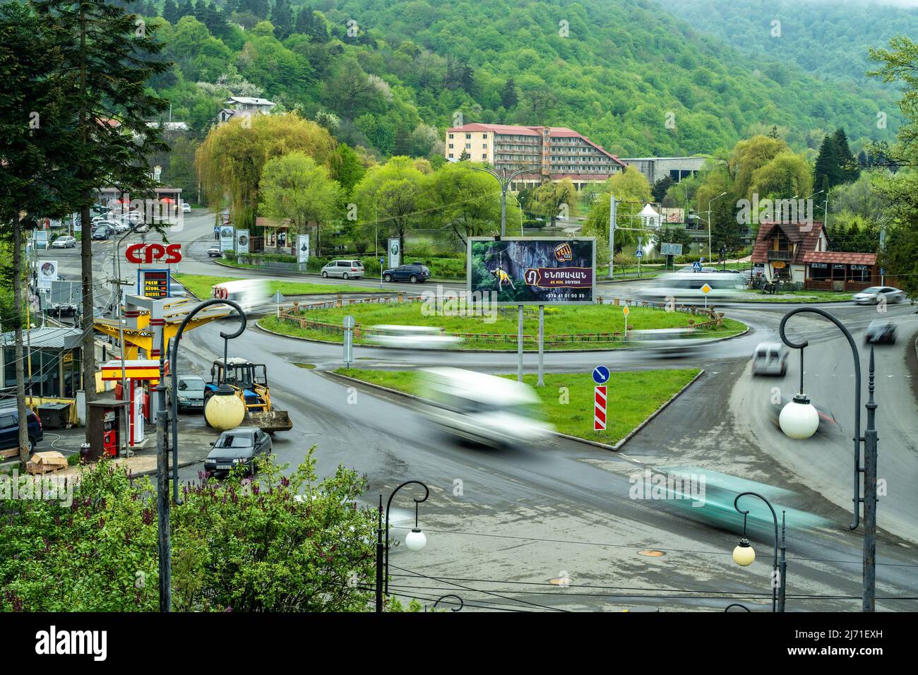 Dilijan, Armenia - May 5, 2022 - Cars drive around and through the roundabout in Dilijan, Armenia, captured with slow shutter speed Stock Photo