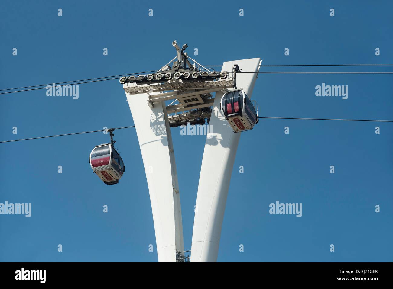 The Emirates cable car over The Thames between The Royal Docks and The Greenwich Peninsula, London. Stock Photo