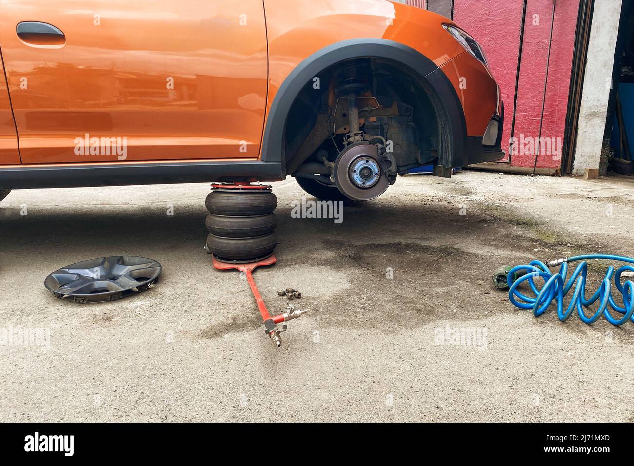 Technicians are fixing wheel. Wheel balancing or repair and change auto tire. Car repair concept