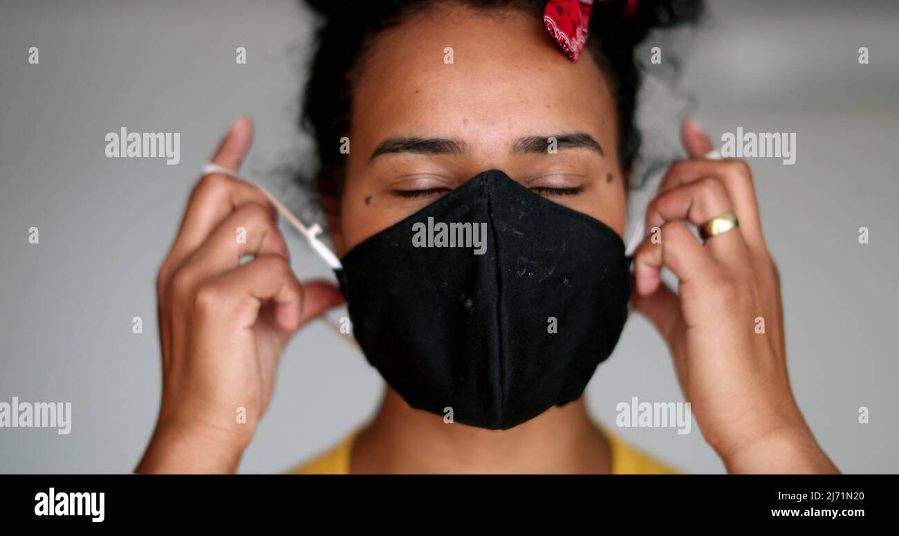 African woman taking off covid hi-res stock photography and images - Alamy