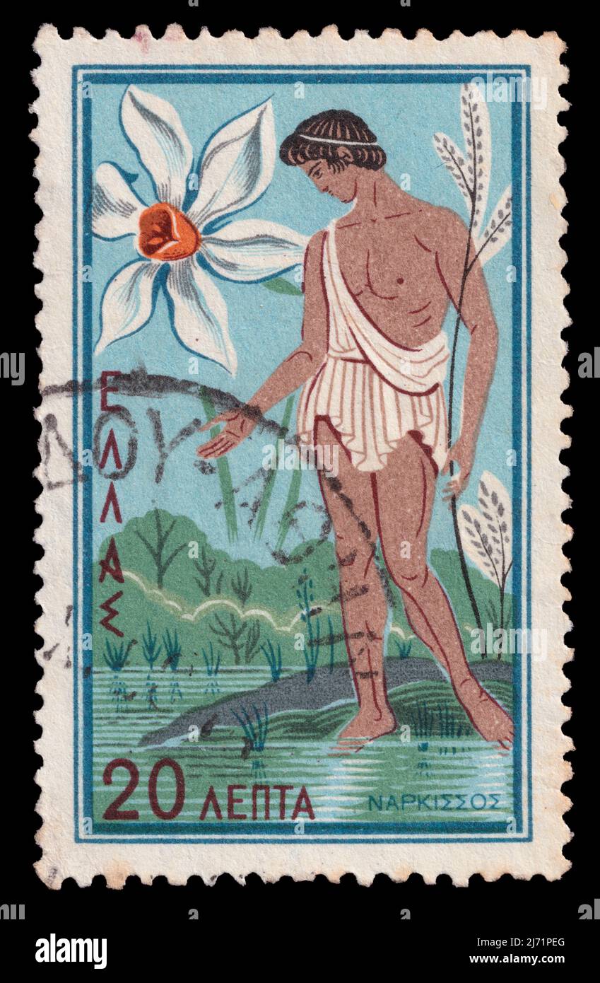 Narcissus looking at his reflection in lake water and daffodil flower vintage illustration on postmarked postage stamp printed in Greece circa 1958. Stock Photo