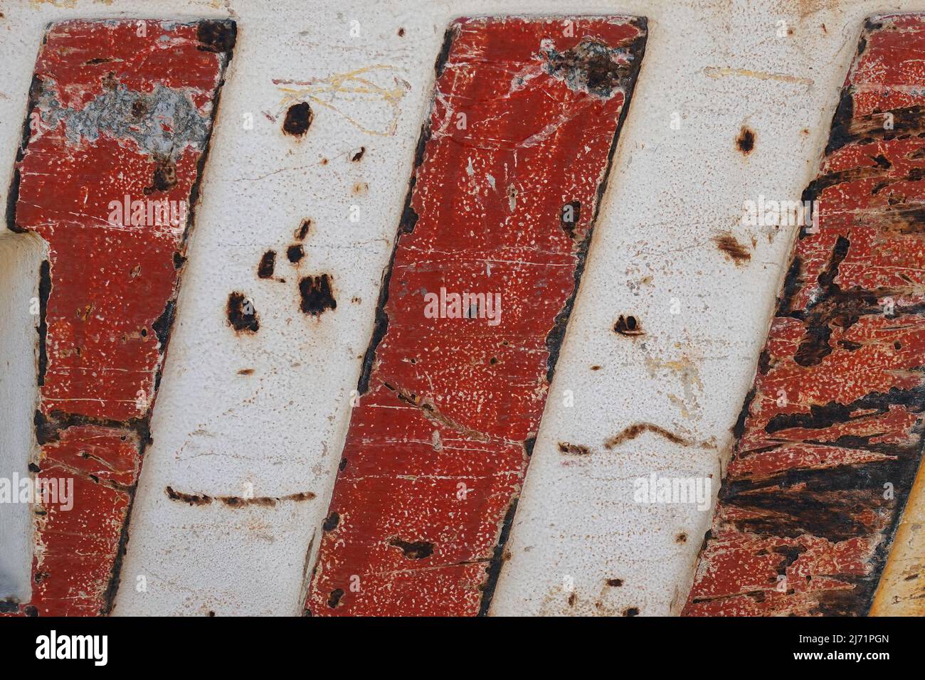 Rusty metal texture with red stripes. Abstract background. Stock Photo