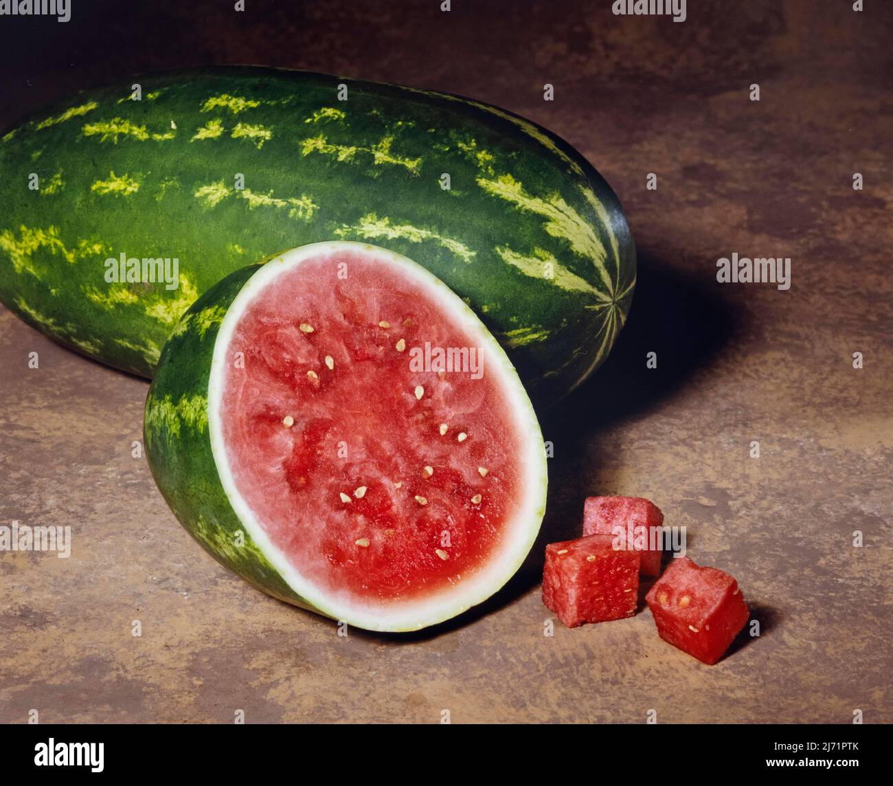 Watermelon cut in half and with cubed pieces.  Image from 6x7cm film transparency. Stock Photo