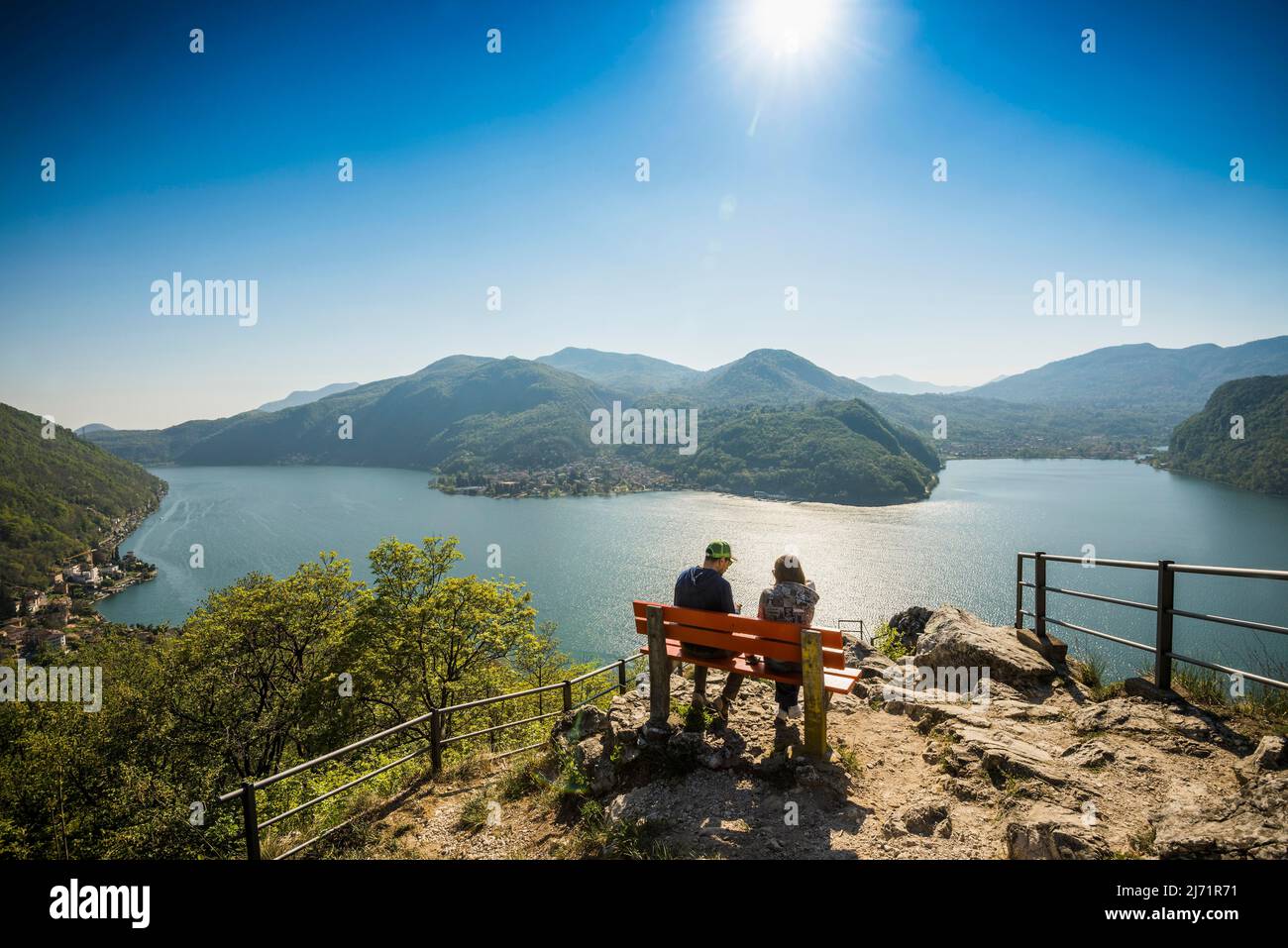 Viewpoint with couple on a bench, Sasso Delle Parole, near Lugano, Lake Lugano, Lago di Lugano, Ticino, Switzerland Stock Photo