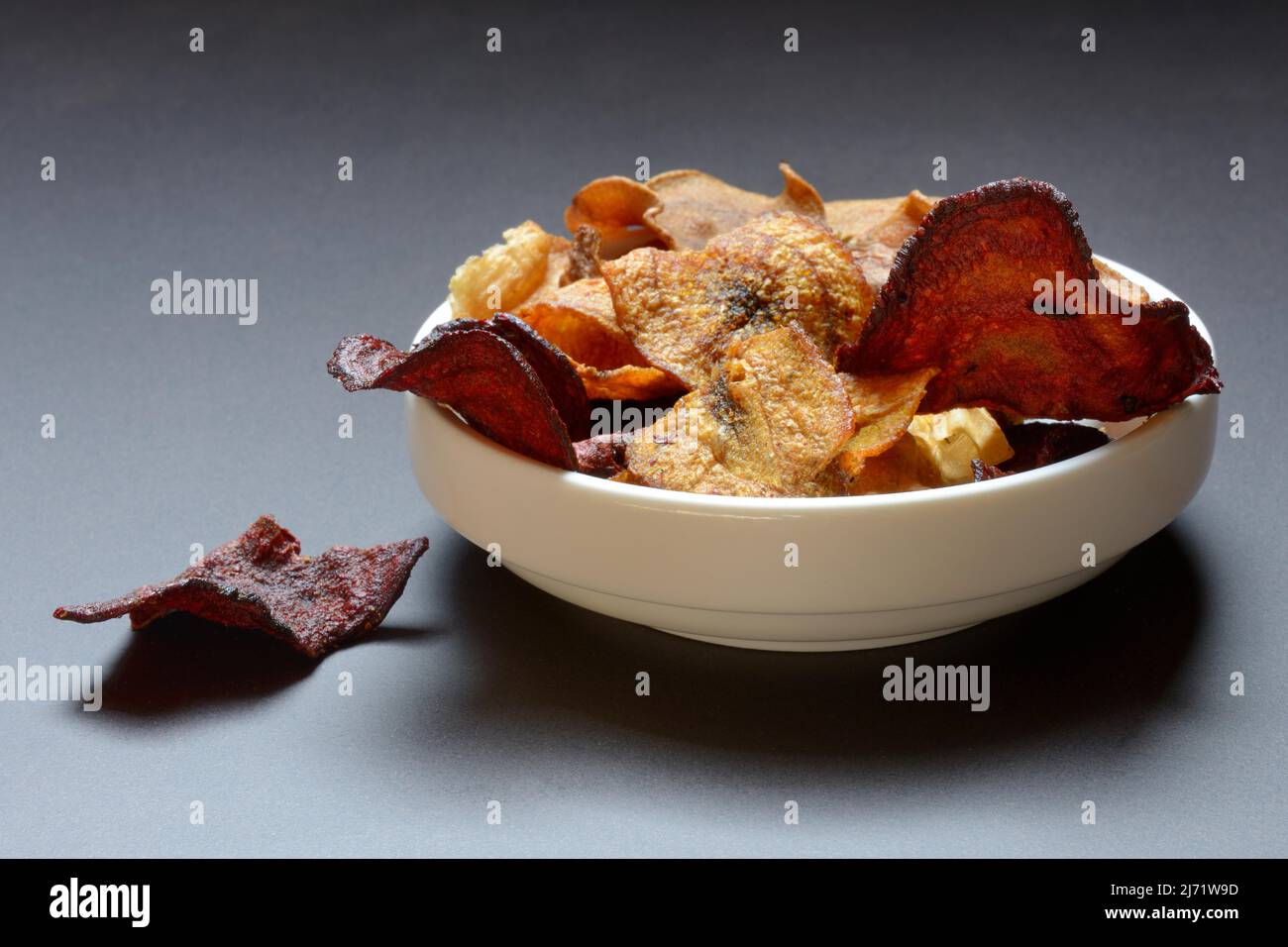 Vegetable chips in shell, consisting of carrots, beetroot and parsnips Stock Photo