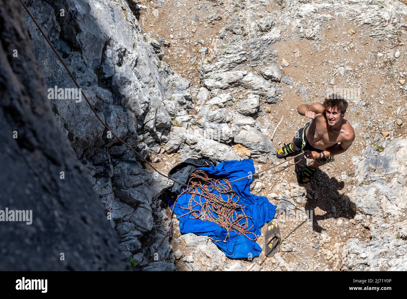 Climber belays on the ground, sport climbing, Kalymnos, Dodecanese, Greece Stock Photo