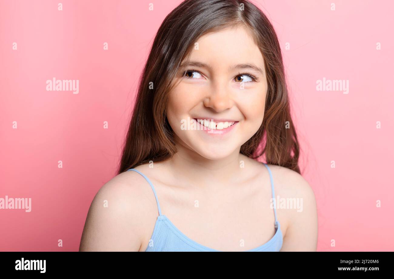 cute child over pink backgroud on studio Stock Photo