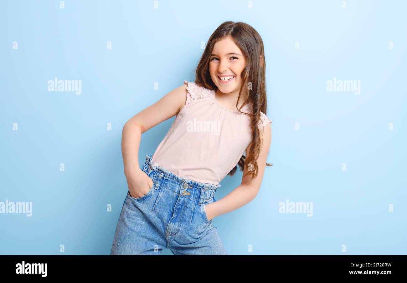 cute child over blue background on studio Stock Photo