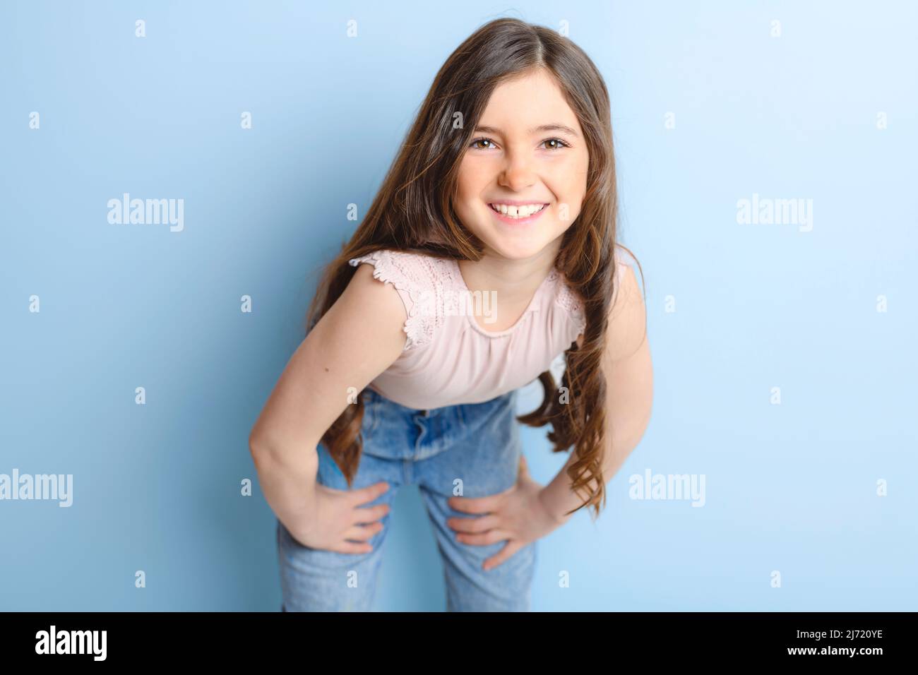 cute child over blue background on studio Stock Photo