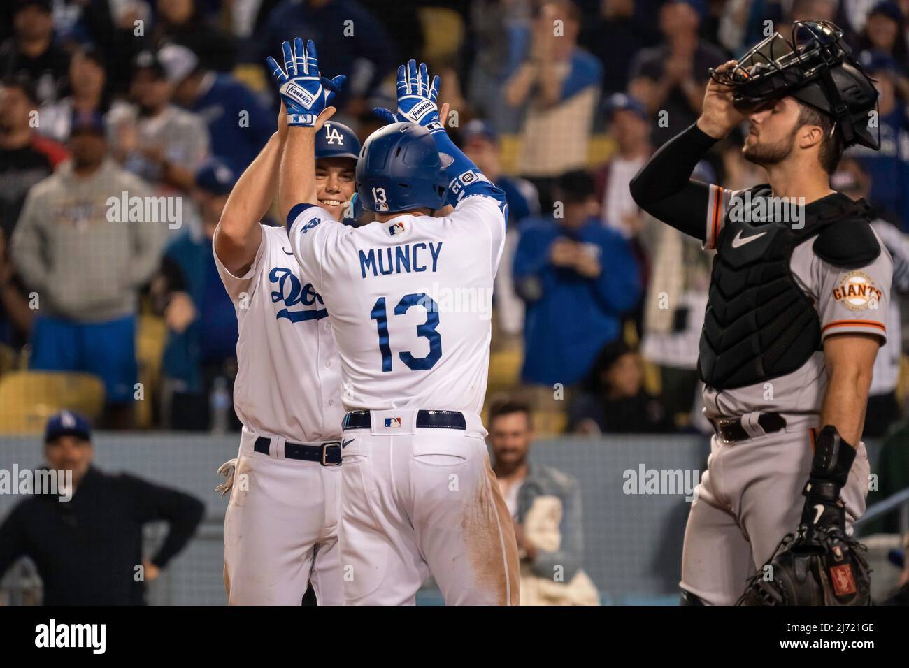 Los Angeles Dodgers second baseman Max Muncy (13) is congratulated