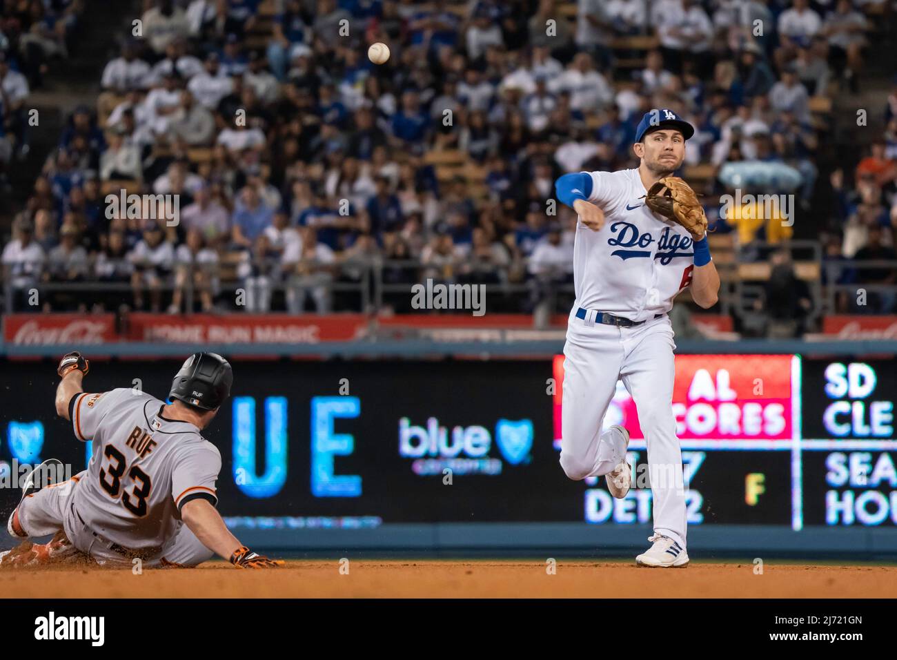 Los Angeles Dodgers shortstop Trea Turner (6) throws to first after forcing out San Francisco Giants left fielder Darin Ruf (33) at second base during Stock Photo
