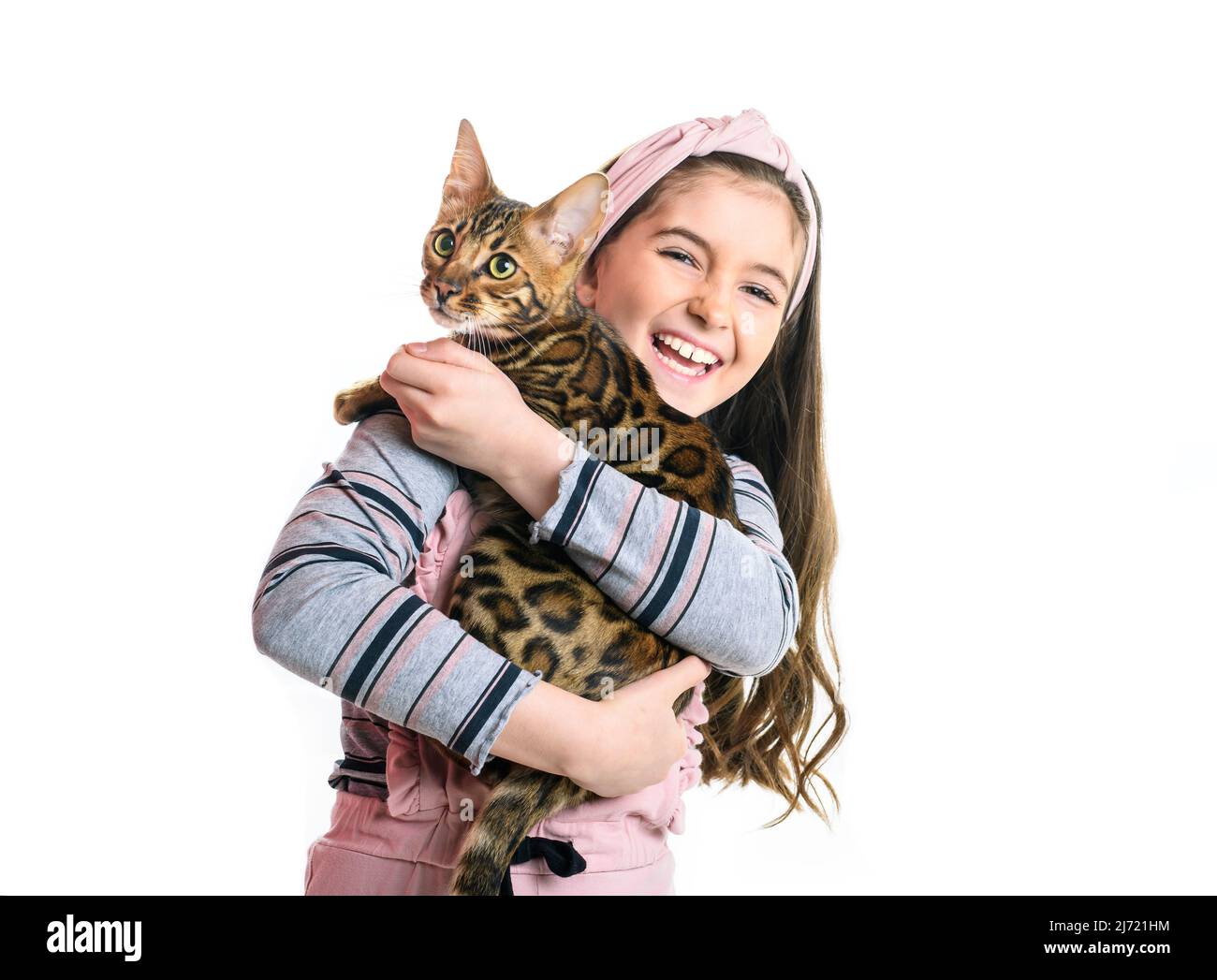 little girl holding bengal cat isolated on white background Stock Photo